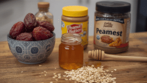 A cozy kitchen scene with a wooden countertop, a bowl of dates, oats, honey, and peanut butter jars. Natural sunlight coming through the window, a rustic aesthetic, professional food photography style, ultra-realistic.