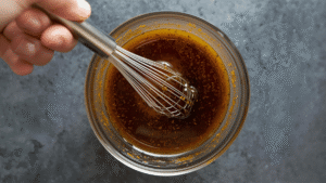 This dressing feels like therapy in a bowl. The balsamic adds depth. The orange zest brightens everything. Ginger wakes me just enough to feel present. Cinnamon brings quiet warmth. I whisk it all together and breathe in the scent — warm, bright, calming.